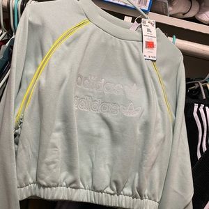 Light blue Adidas cropped sweater.